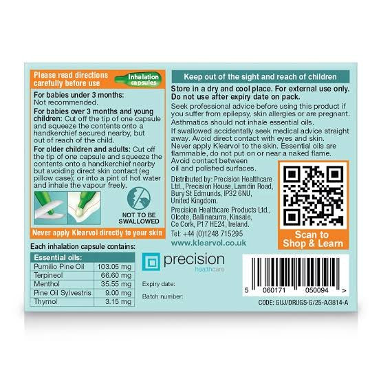 The back of a Klearvol pack and its corresponding printed packaging insert for 'Klearvol' essential oils by Precision Healthcare Products. The insert features a light teal background with orange, black, and white text detailing instructions, warnings, and essential oils, alongside a QR code.