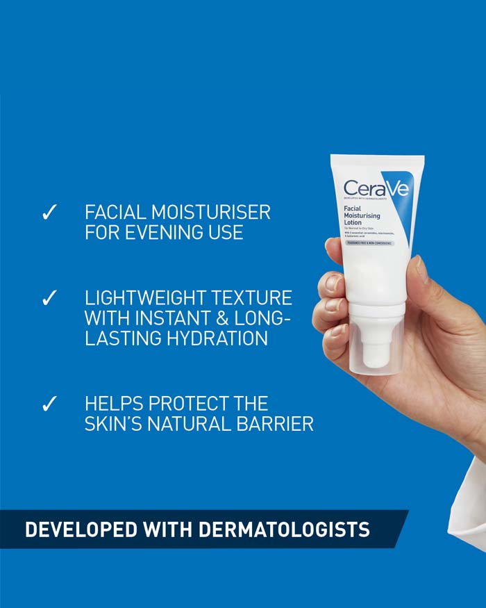 Image showing Cerave facial moisturising lotion being held up in a right hand in front of a blue background