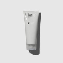 Image of light grey tube of Sons Conditioner against a light background with shadow behind it
