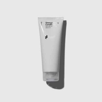 Image of light grey tube of Sons Conditioner against a light background with shadow behind it
