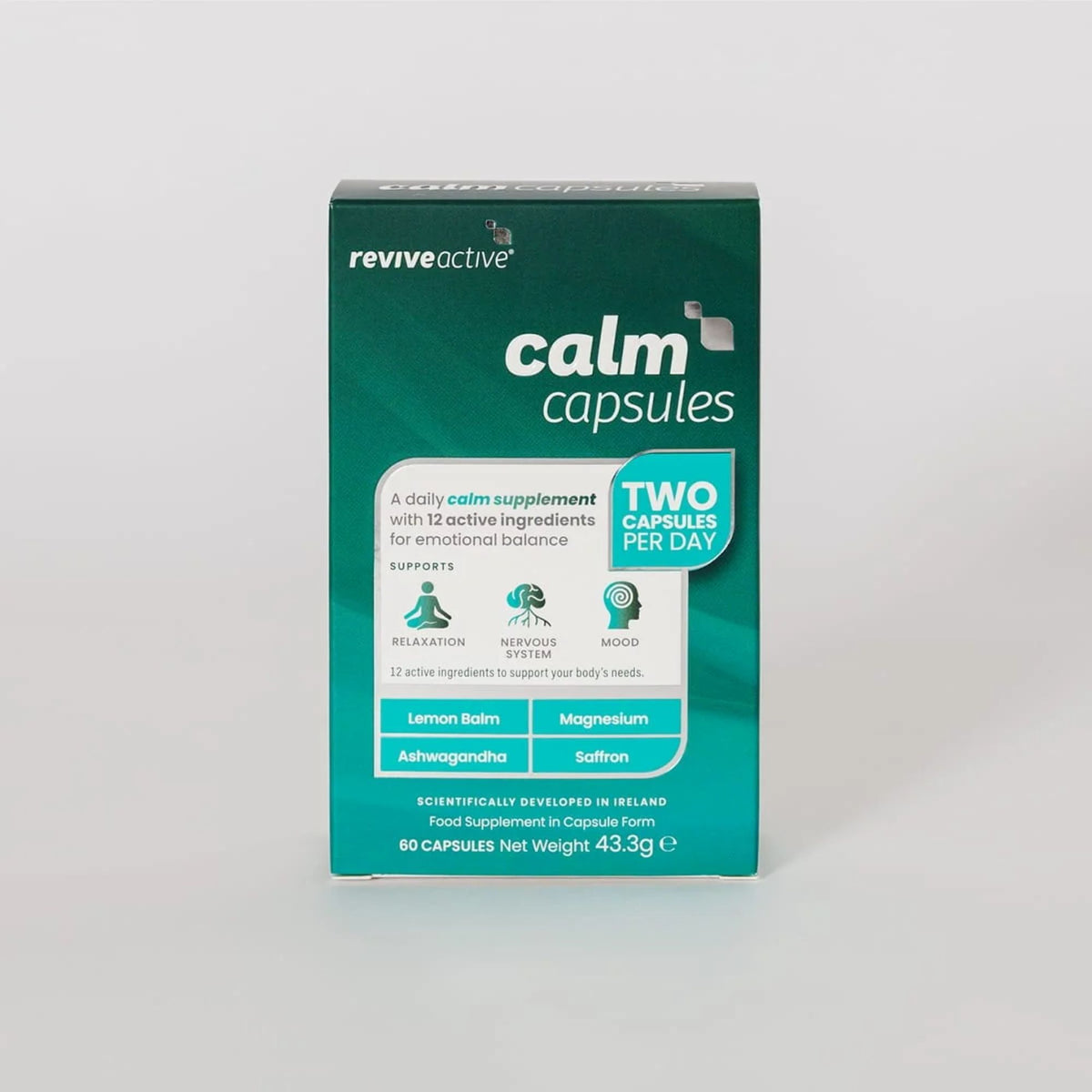 A box of Reviveactive Calm Capsules, a daily calm supplement, shown on a light gray background. The packaging is dark teal green with white and light blue text and graphics, indicating a two-capsule-per-day dosage.