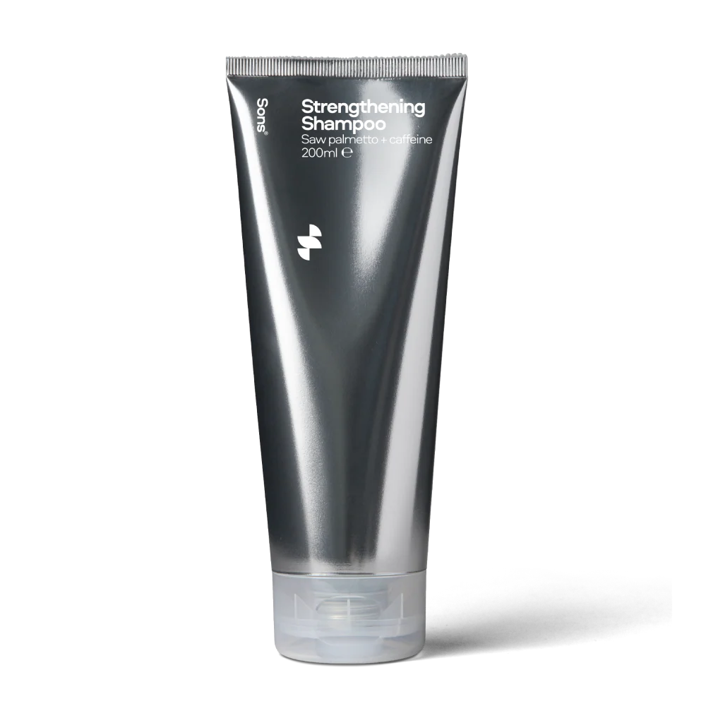 Deep silver grey tube of Sons Strengthening Shampoo on a white background.