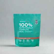 A teal stand-up pouch of Whole Foods 100% Nutritionally Complete Meal in Chocolate Shake flavor, photographed against a neutral light gray background.
WHOLESUPP Chocolate meal replacement pouch, front view.