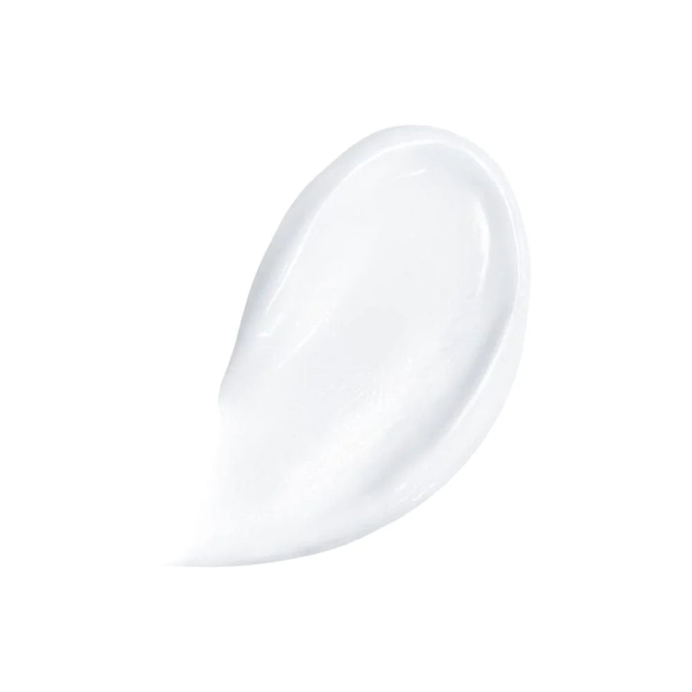 Image of white lotion smeared on a white background to demonstrate the texture of CeraVe Moisturising Lotion.