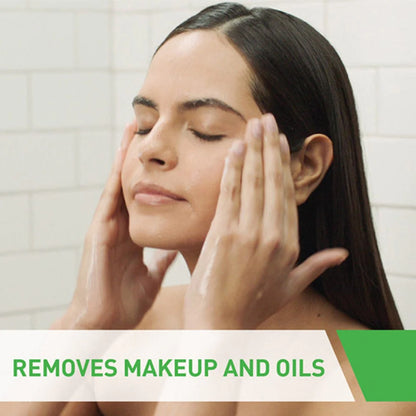Image of Cerave hydratiing cream cleanser in use. It is being massaged onto the face. It is non foaming and hydrating with a statement at the bottom of the photo that says removes makeup and oils.