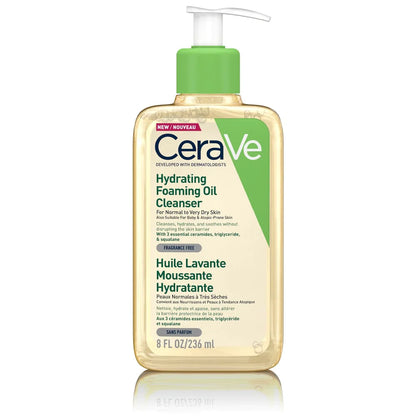 A pump bottle of CeraVe Hydrating Foaming Oil Cleanser with a green label and clear liquid visible inside.