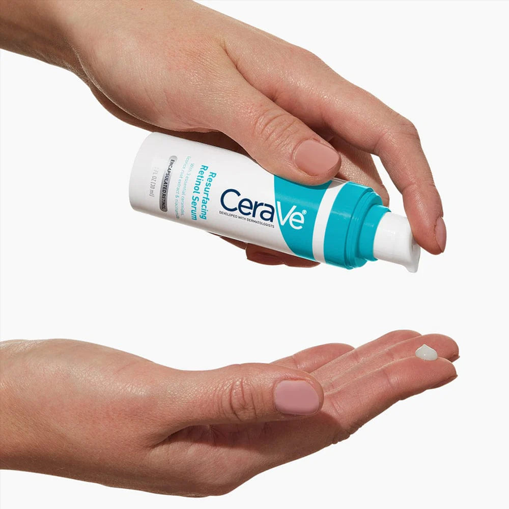 Photograph of CeraVe Resurfacing Retinol Lightweight Serum pump being dispensed onto fingertips.