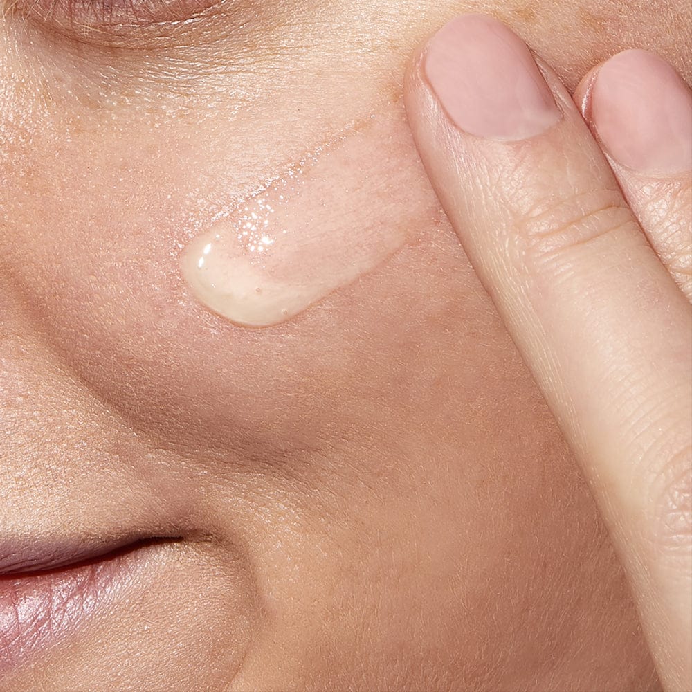 CeraVe Resurfacing Retinol Lightweight Serum being applied to cheek