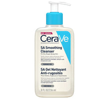 A pump bottle of CeraVe SA Smoothing Cleanser with blue and white label, indicating that it's enriched with ceramides and hyaluronic acid and is fragrance-free.