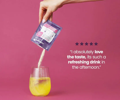 Hand pouring a drink mix into a glass with a pink background and text about the taste.