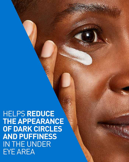 Person applying cream under eye with text on a blue background