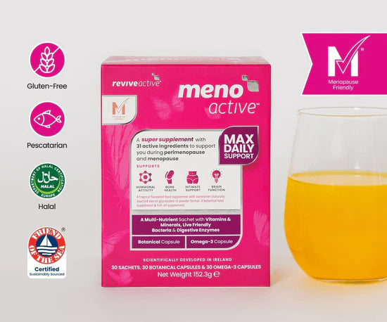 Pink 'meno active' supplement box with a glass of orange coloured juice on a white background
